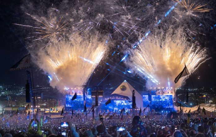 fireworks go off above the Pyramid Stage at Glastonbury Festival 2023