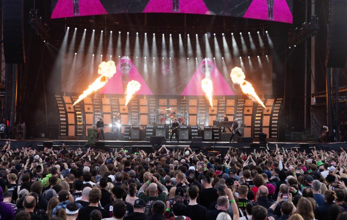 Green Day performing in Manchester on the Saviors tour